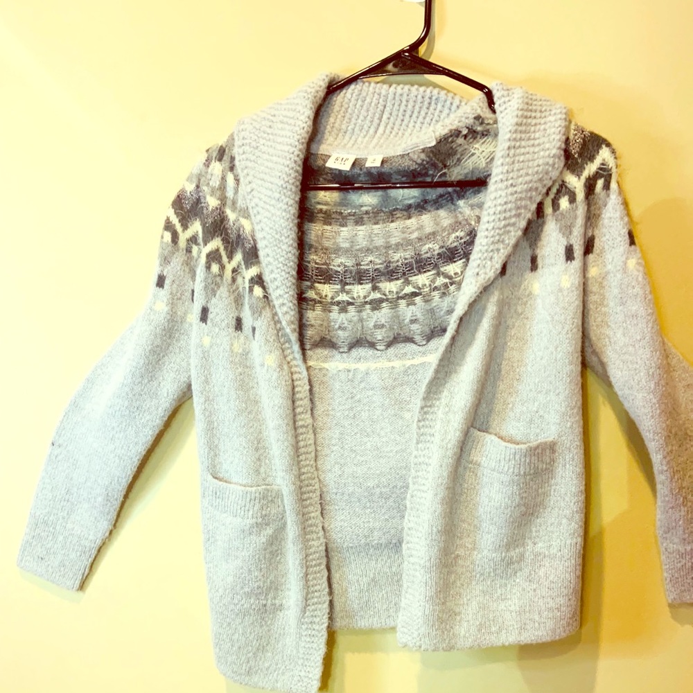 A gray and white cardigan for kids